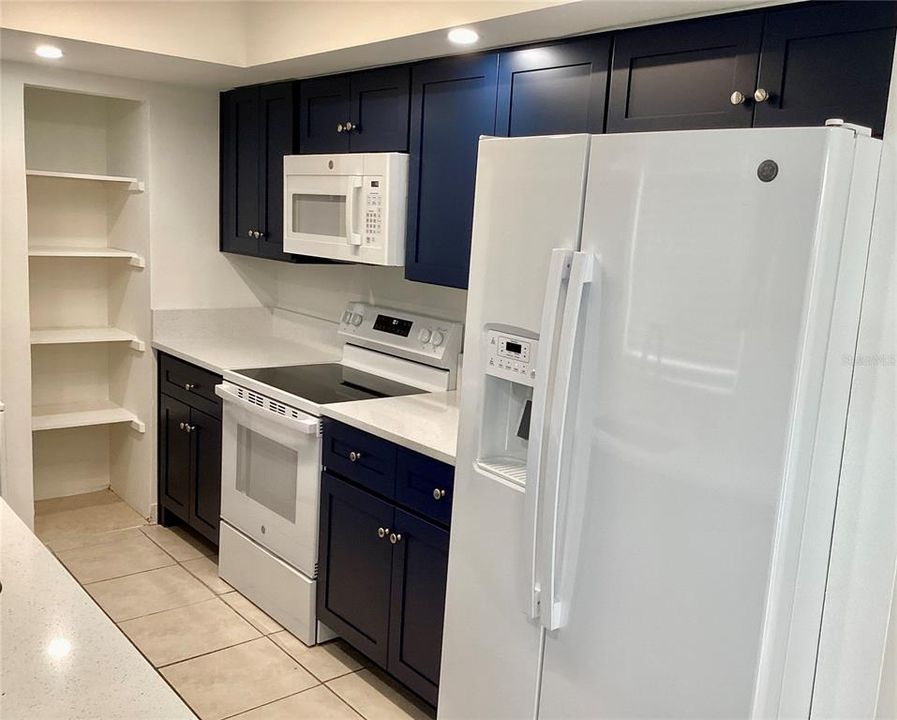 Extra cabinet spaces to the left of the stove