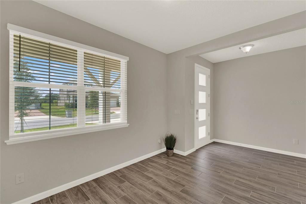 Entry with office view or formal living room