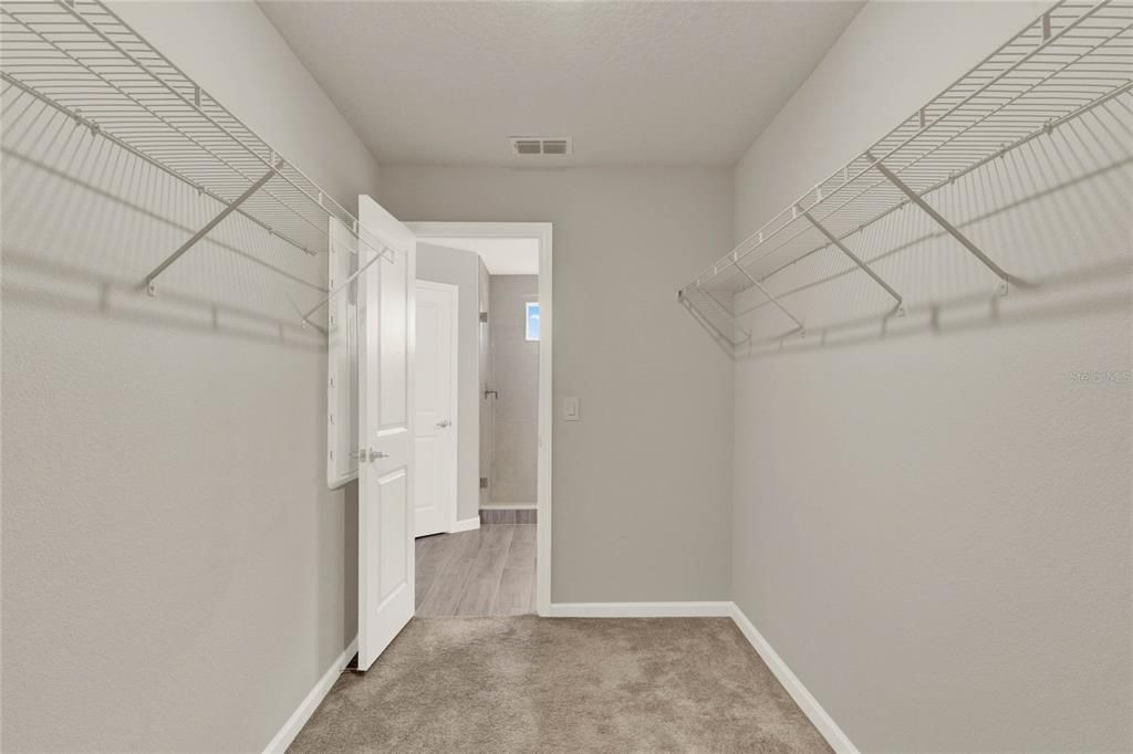 Closet in primary bedroom