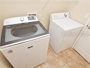 Utility room with washer and dryer.