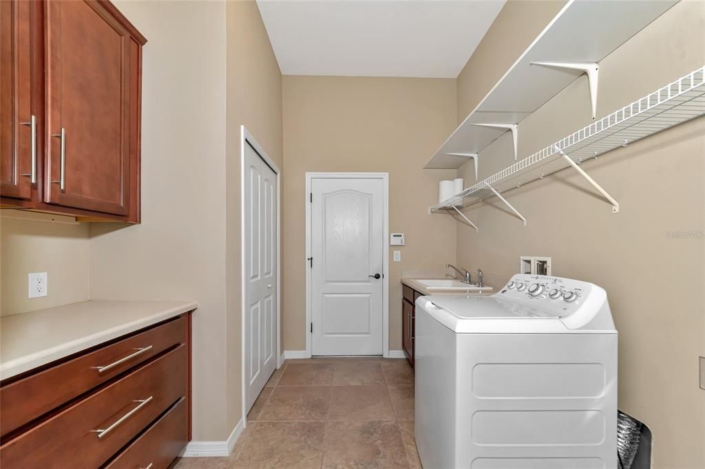 Laundry rm w/ Cabinetry, Folding Area, Storage Closet & Sep Sink