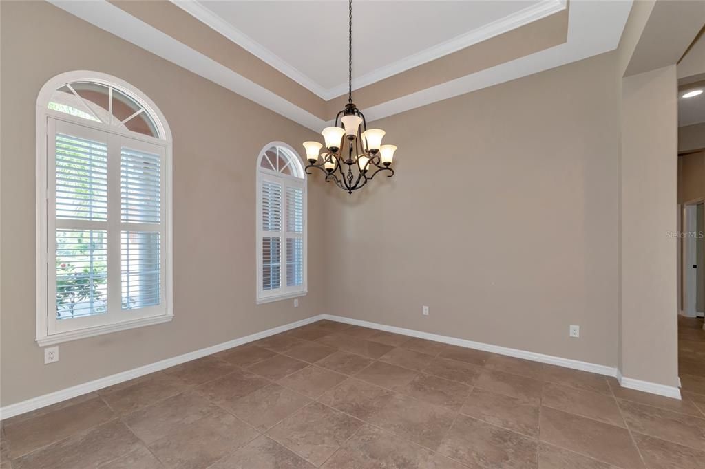 Dining Rm w/ 12 Ft in the Trey ceiling w/ crown molding