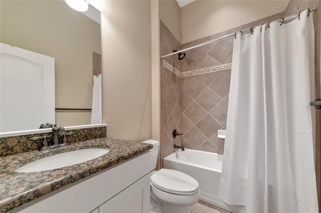 Full Bath 3 - Granite w/ White Cabinetry.  Beautiful Tile in the Shower/Tub