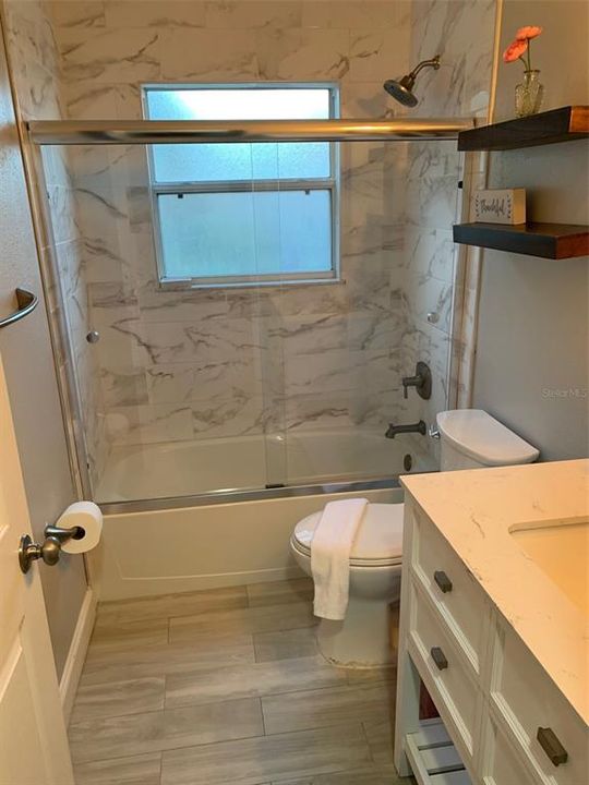 Remodeled bathroom with tile and quartz