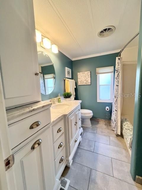 Hallway bathroom with door to 2 ND bedroom