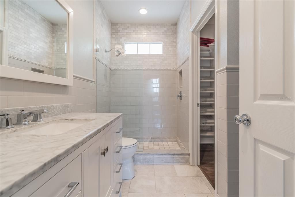 Upstairs bathroom and walk-in closet.