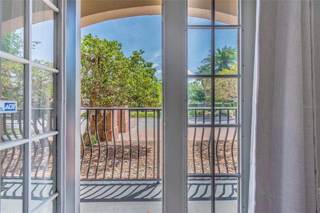 French doors in Downstairs Master lead to covered porch.