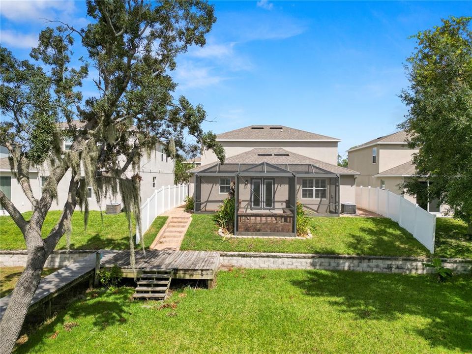 Backyard with Vinyl Partially Fenced with 2 Gates