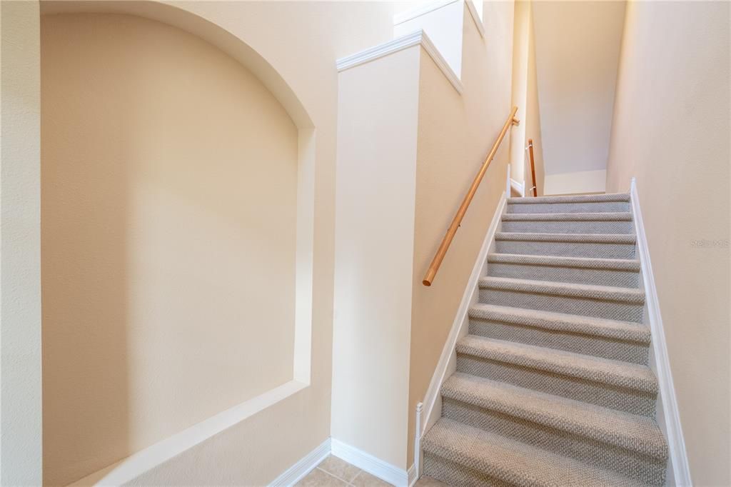 As you step inside, the foyer welcomes you with its breathtaking two-story ceiling, creating an open and inviting first impression that sets the tone for the rest of the home.