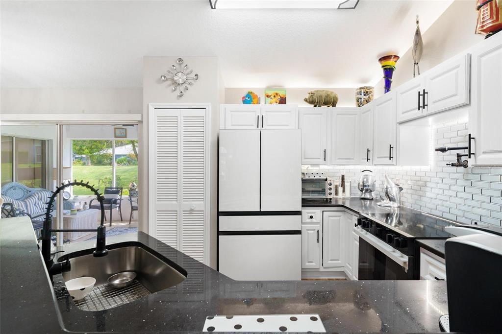 Kitchen with New Samsung Refrigerator and Range, and Closet Pantry