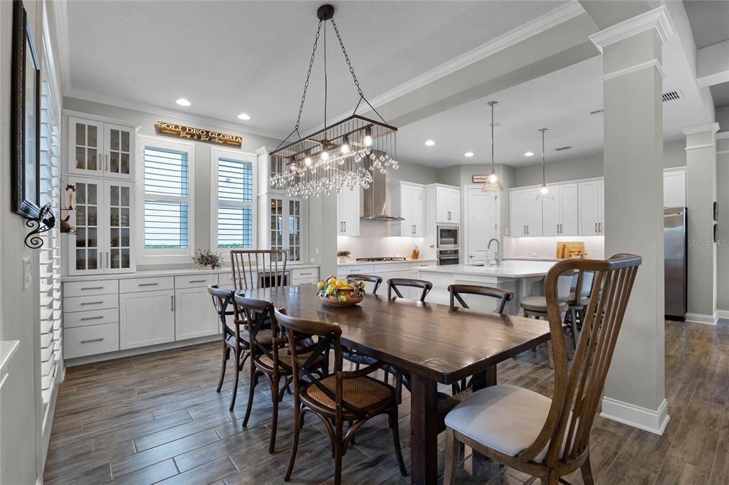 The gorgeous dining area is located conveniently next to the kitchen and has access to the wraparound porch.