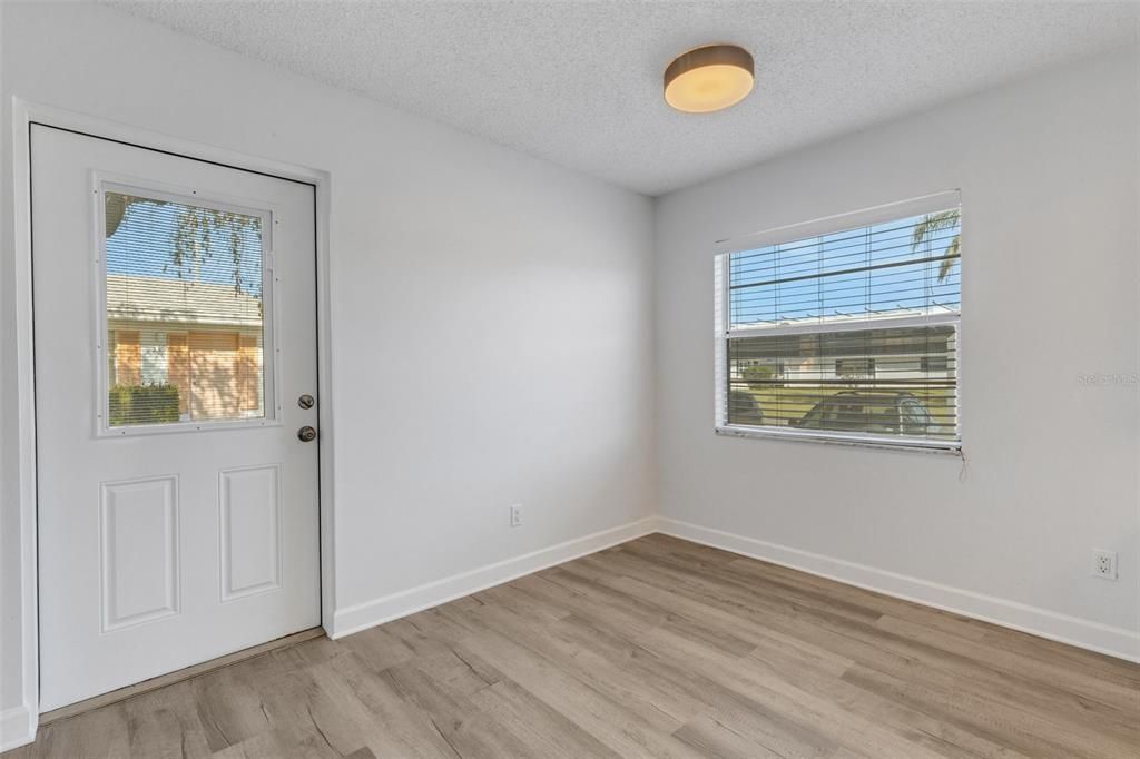 Front door with dining area and nice light in window.