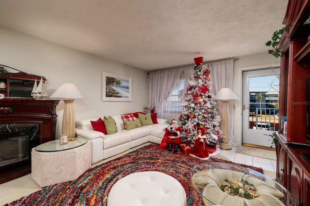 Living room with bay views & screened storm door.