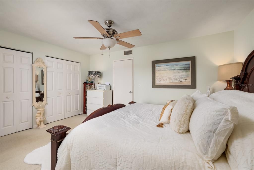 Primary bedroom w/double closets.