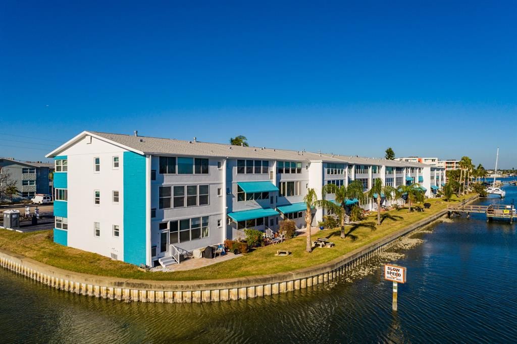 Shore Plaza Condos surrounded by Boca Ciega Bay.