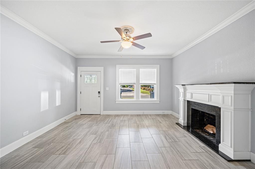 Living room with view of front door and porch