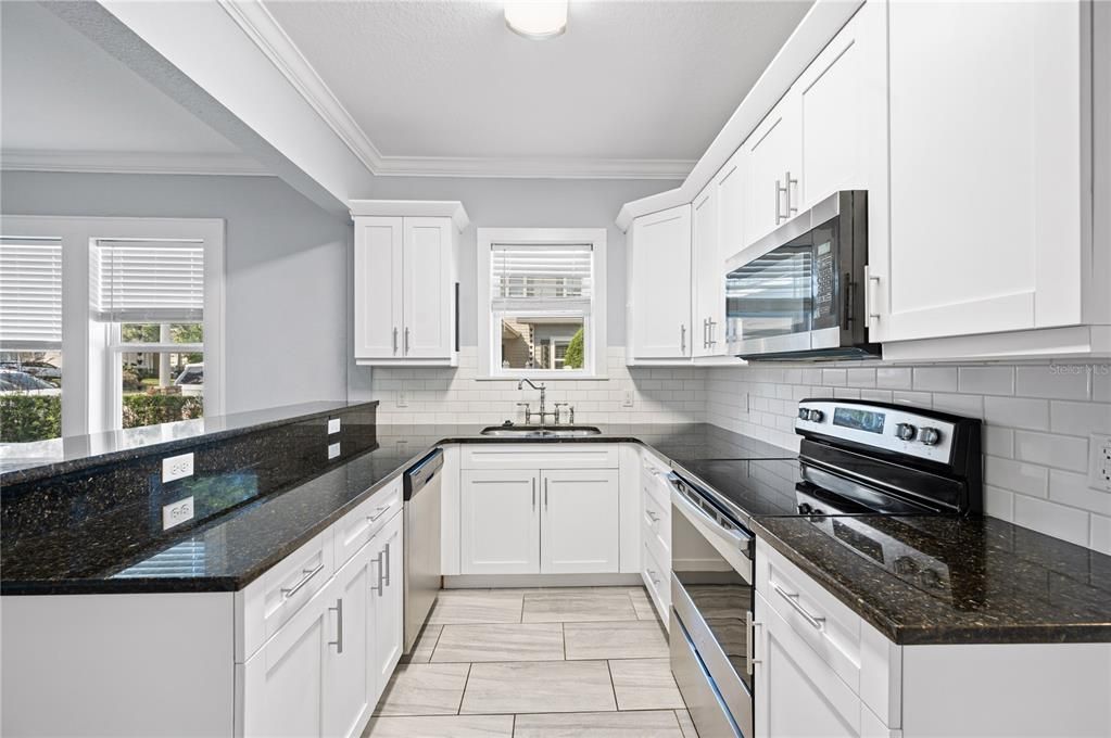 Kitchen with granite countertops and stainless steel appliances