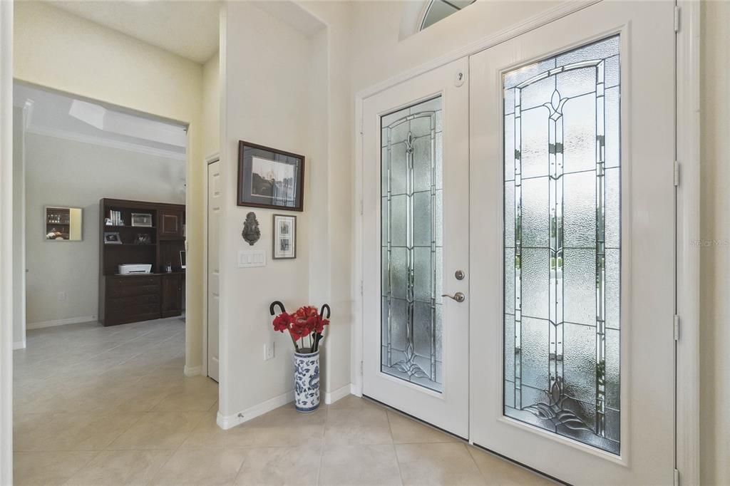 Front entry with leaded glass door and hurricane latch for safety