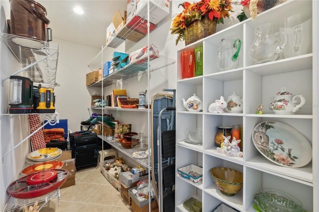 Amazing extra storage area off of the kitchen separate from the pantry!