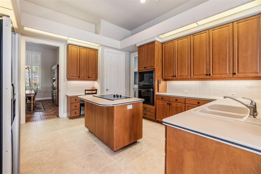 Open Kitchen, 12 ft ceilings, Tile Flooring and inset lights.