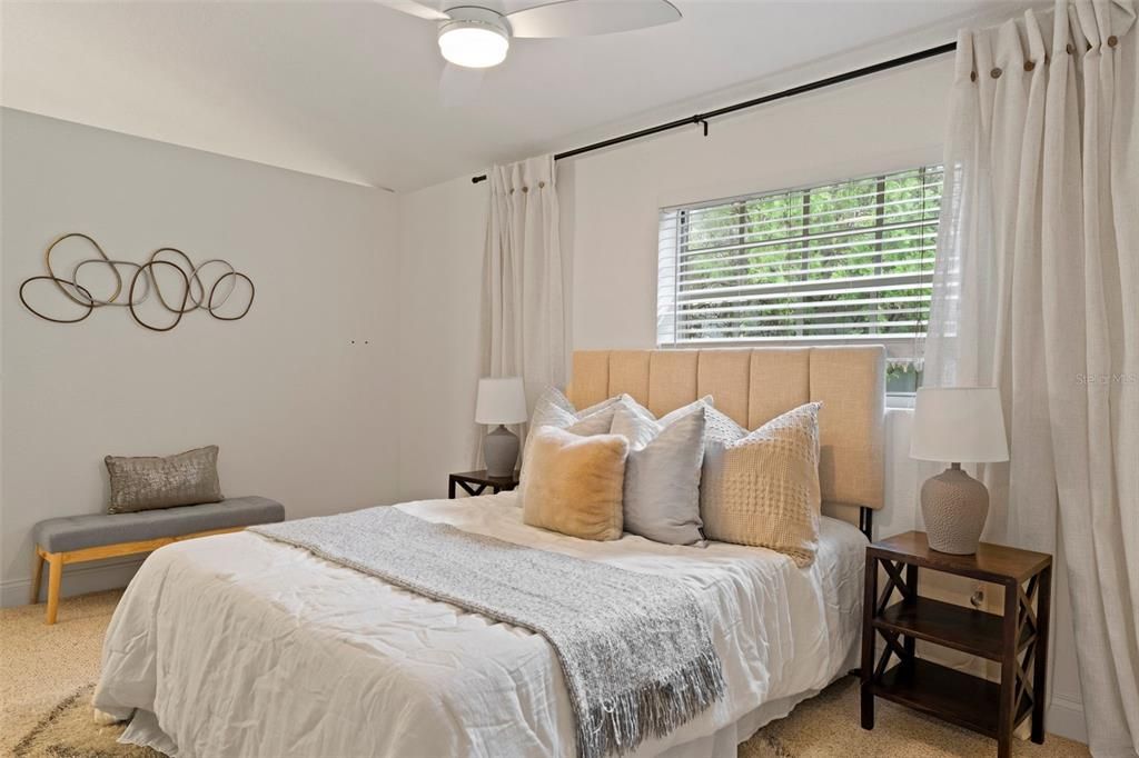 Primary bedroom with vaulted ceilings