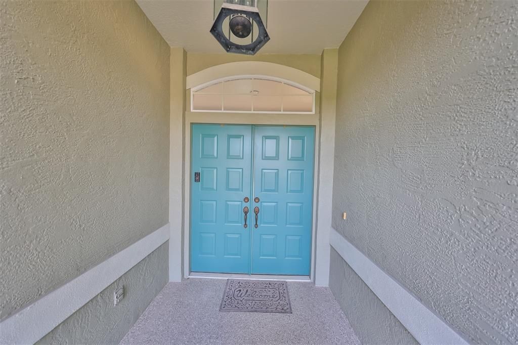 Entry doors to outdoor oasis.