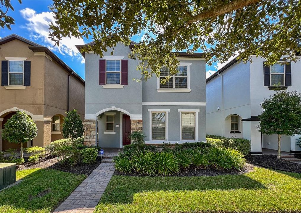 paver walkway and well maintained lawn