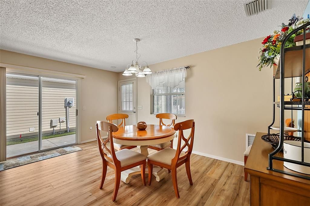 Dining area w/sliding door access to side patio