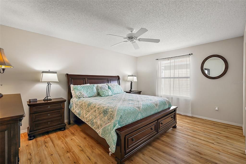 Primary bedroom w/Luxury Vinyl Plank flooring