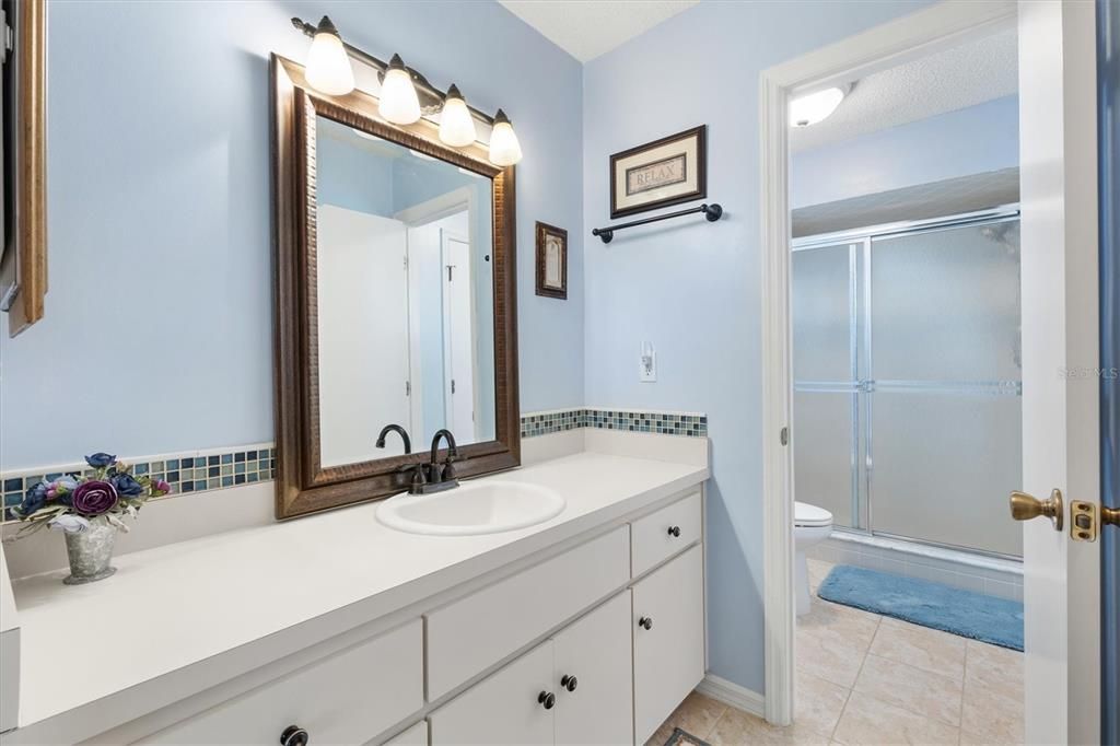 MASTER BATH WITH WALK IN CLOSET.