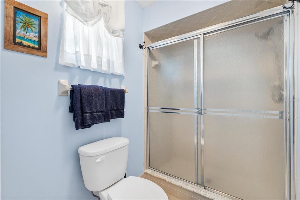 SEPERATE SHOWER AND TOILET WITH A LARGE LINEN CLOSET.