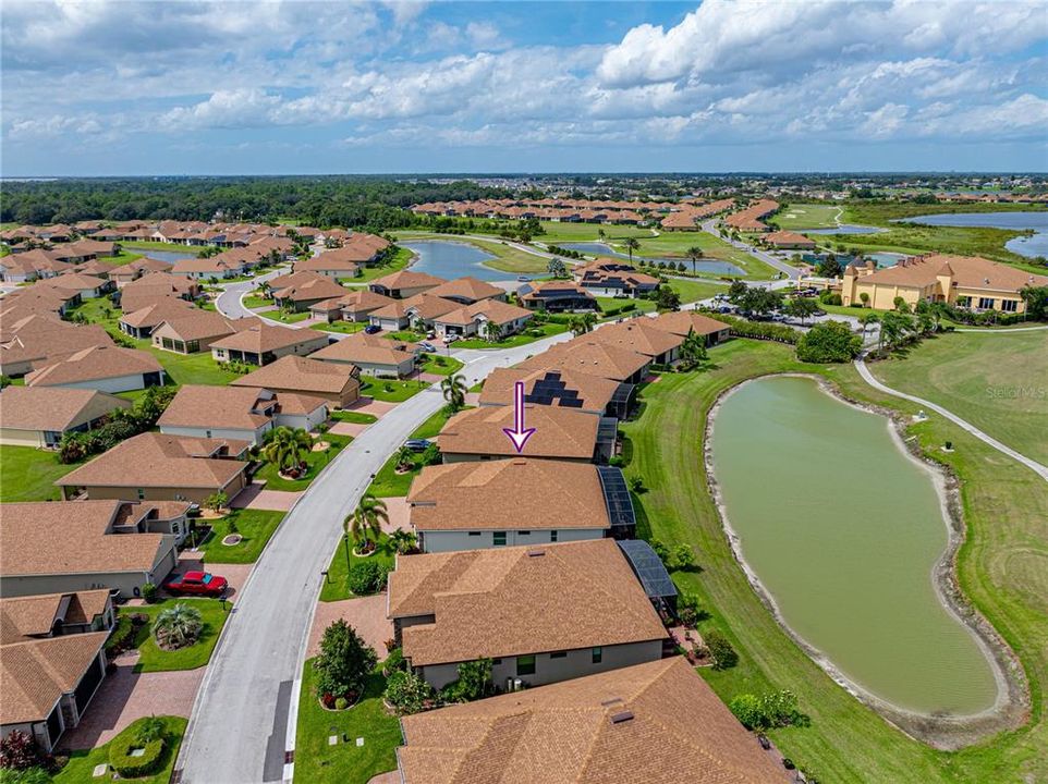 Aerial view showing HFC clubhouse and golf course/pond