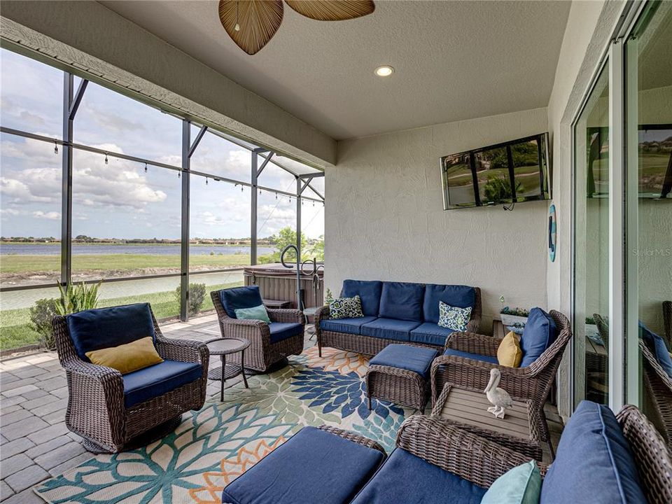 Entertaining lanai with tv and spacious area for outdoor furniture