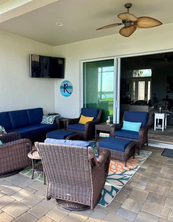 Covered patio area with mounted tv