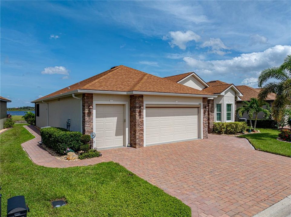 Extended paver sidewalk from front to rear of home