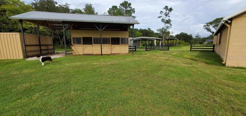 2 STALL BARN W/ PARKING SPACE FOR BOAT OR TRAILER.