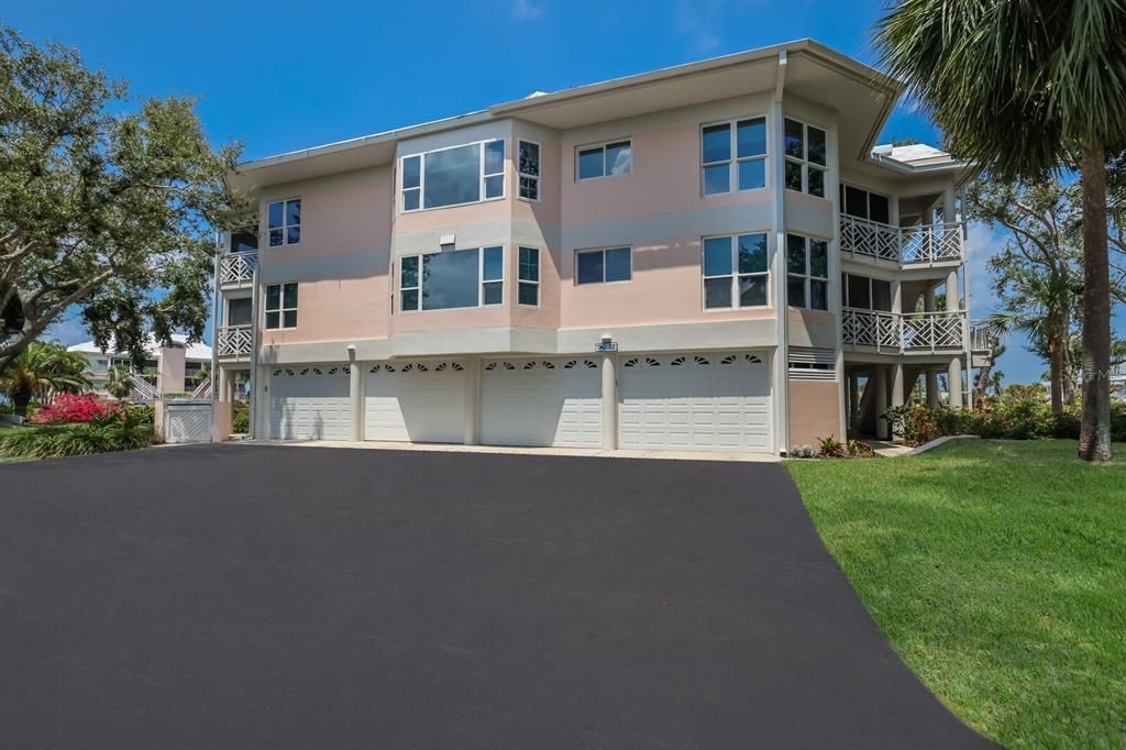 Each unit has a dedicated two-car tandem garage with private garage door; Unit 2203 is on the far right. Garage door has been recently replaced and is TALLER than other garage doors at the Placida Harbour Club thereby permitting taller vehicles/boats/trailers access into the two-car, tandem garage.