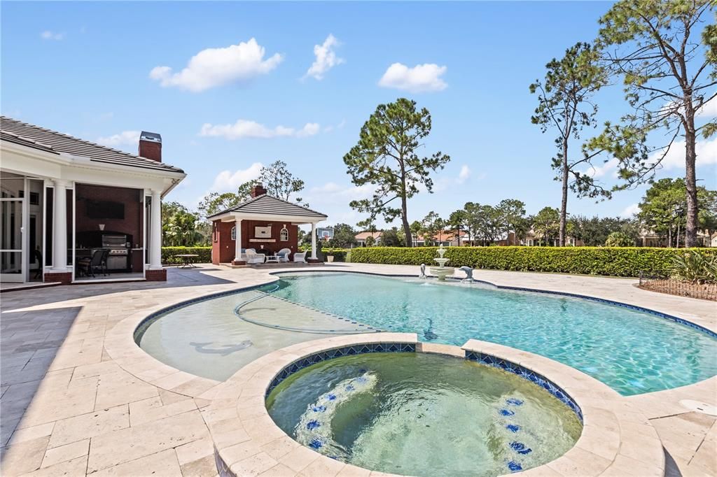 Hot tub just steps from primary bedroom and spacious sun shelf in pool