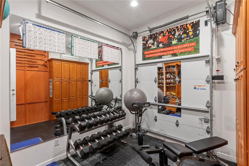 Decked out Golf garage is locker room and practice swing area