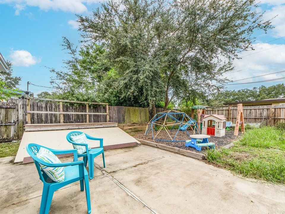 Backyard with space and concrete pad for lots of options