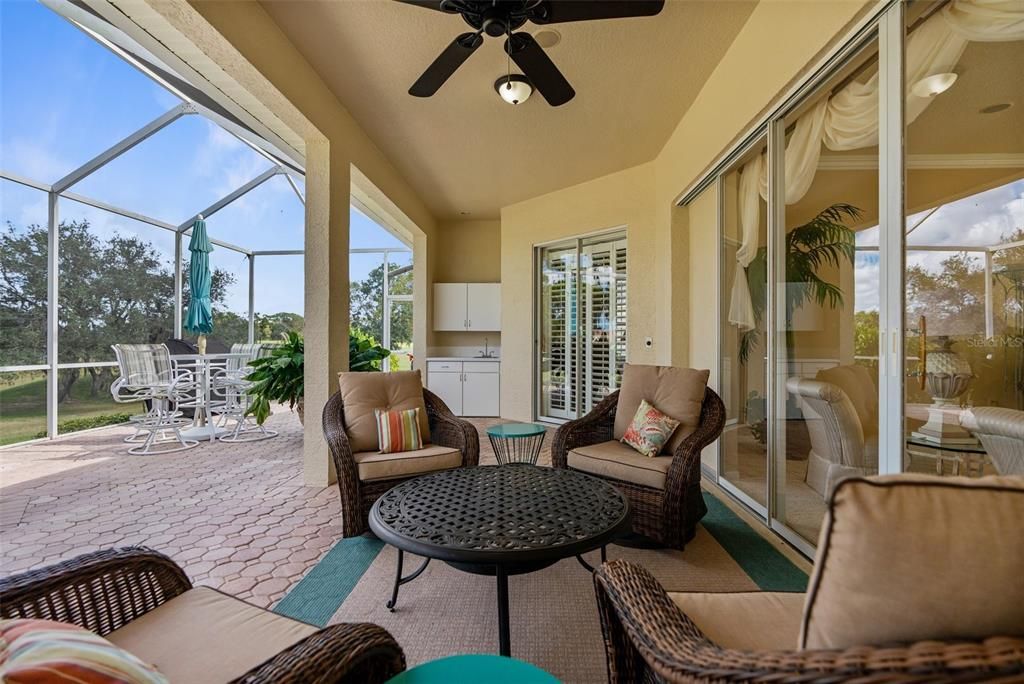 Covered lanai with brick pavers and golf course views!