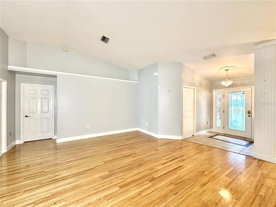 From the Dinette area towards the Primary bedroom and the front door to the right