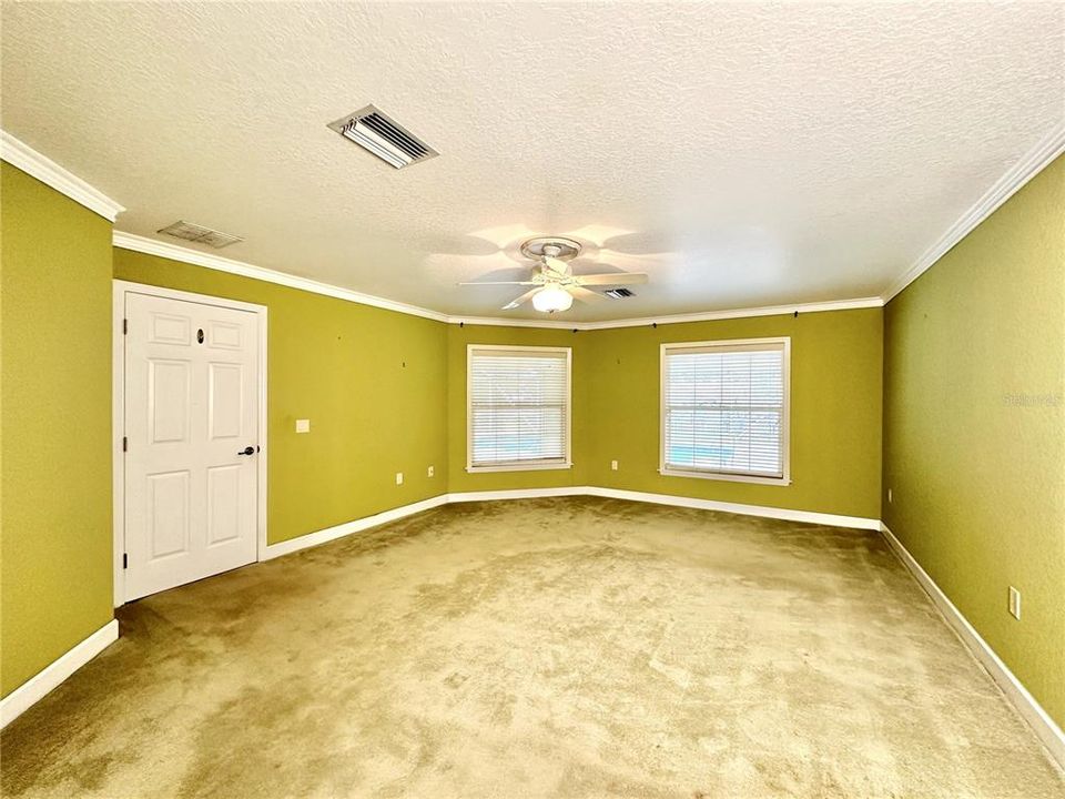 Primary bedroom looking toward the pool