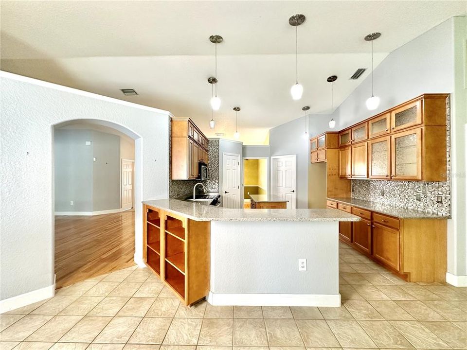 From Family room - dinette on left, living room through the archway