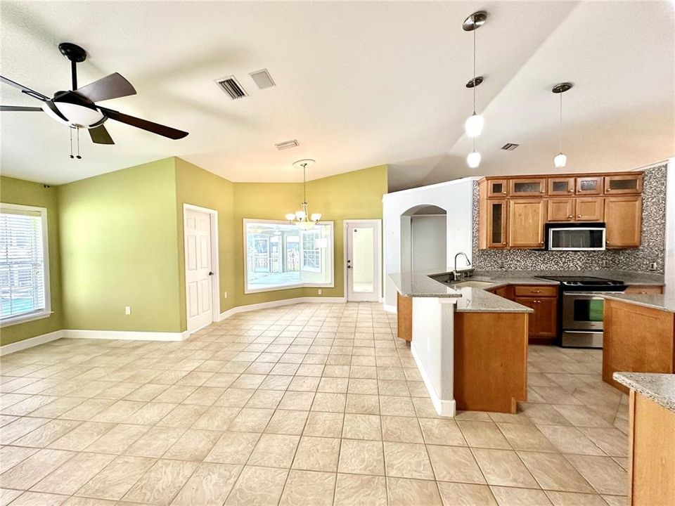 Another view of family room, dinette and kitchen