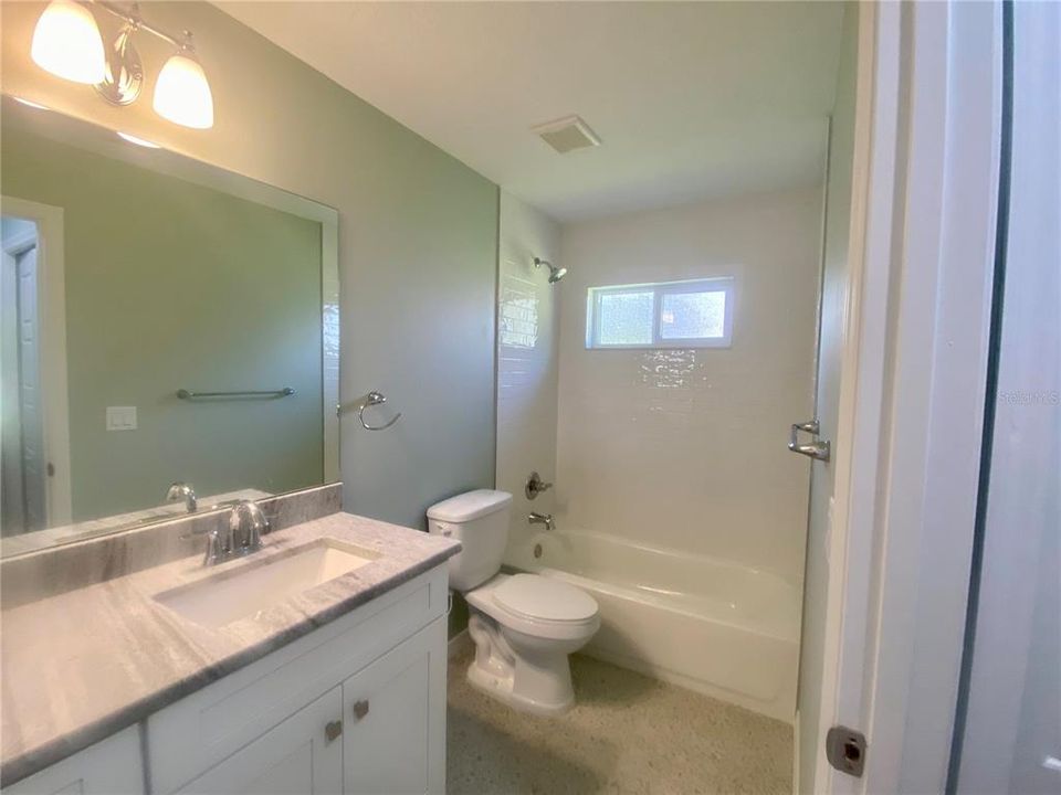 Hall bath, granite counter tops, tub/shower combo