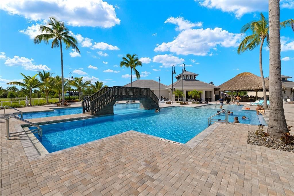 Resort style pool with overhead water bridge