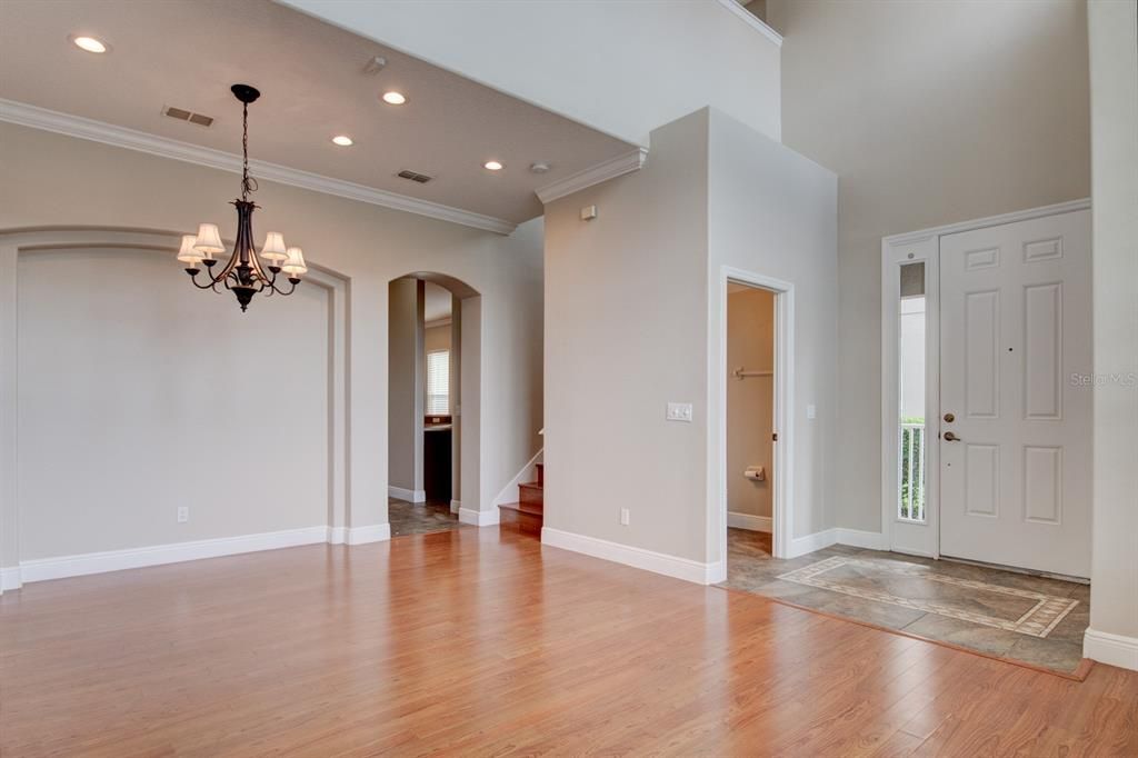 Foyer entry with 2 story ceiling, half bath