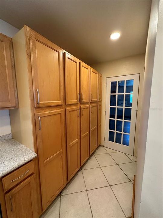 Kitchen wall pantry leading to garage and laundry.