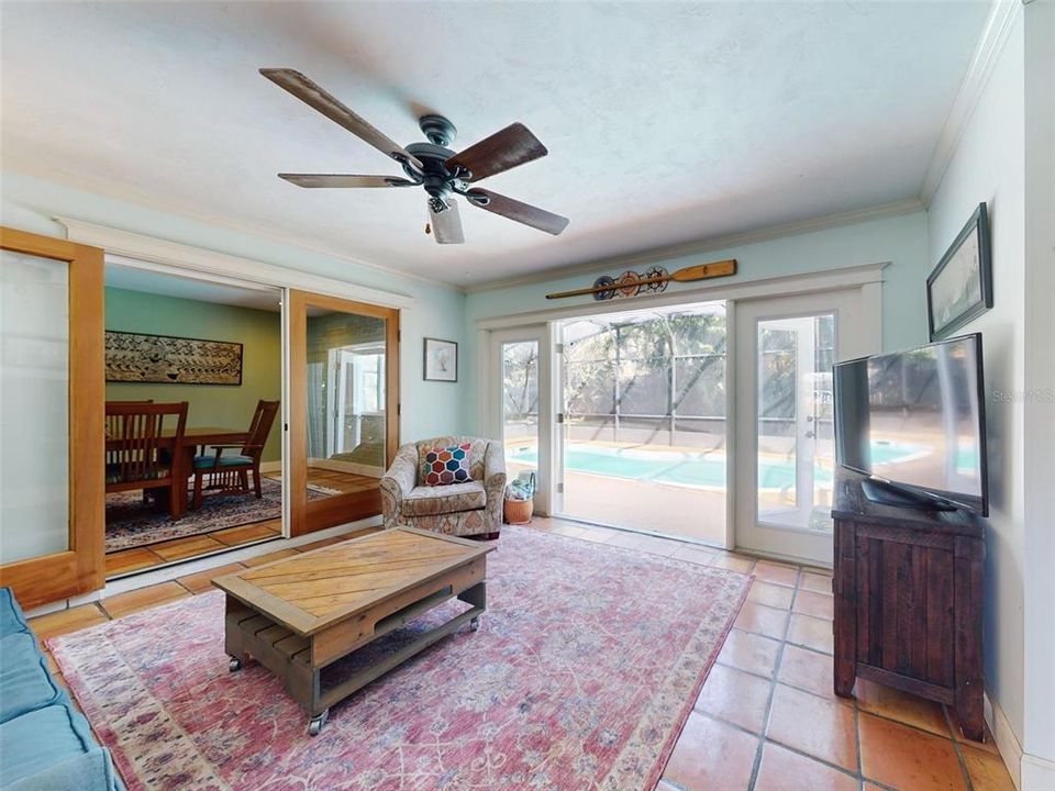 Sun room with French Doors leading to pool through the French Doors